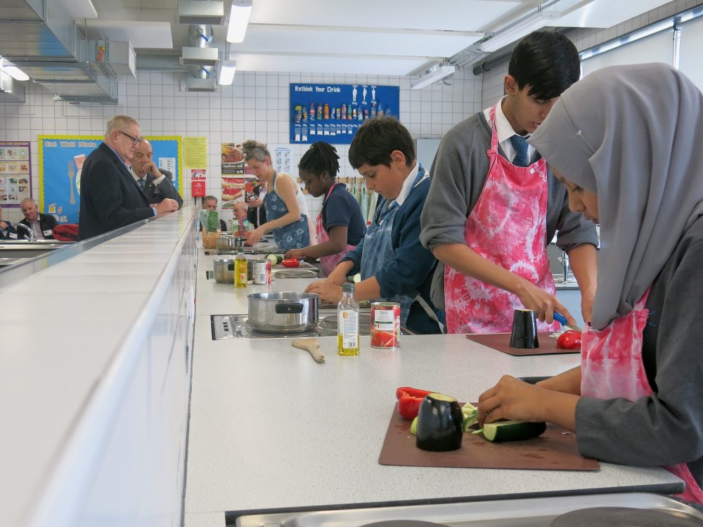 Pupils of Bow School cooking lunch for The Geezers
