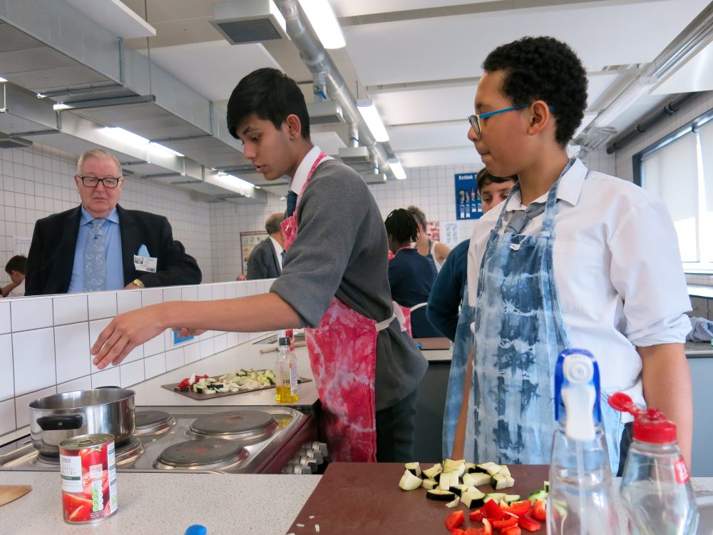 Pupils of Bow School cooking lunch for The Geezers