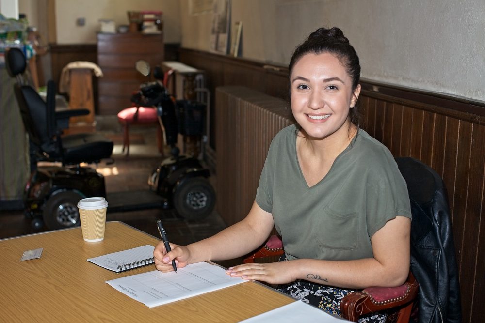 Busra Bakar, Legal and Benefits Advisor at Bow Food Bank, inside Bow Church.