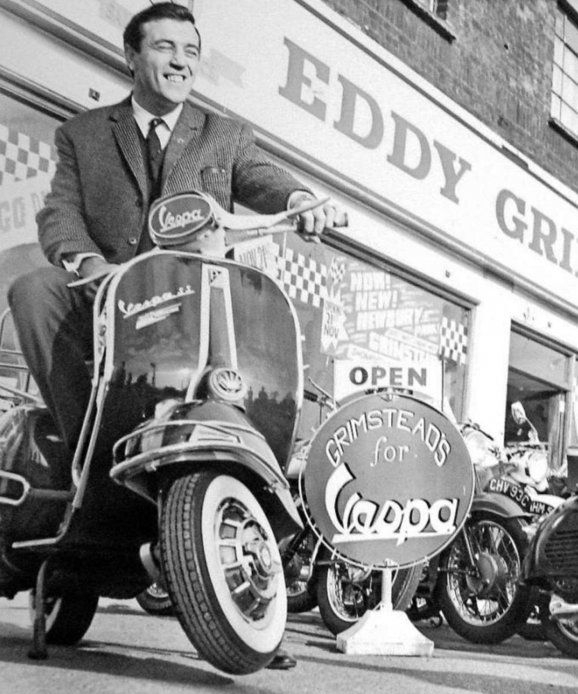 Eddy Grimstead on a Vespa SS180 outside the Newbury Park shop on the official opening day