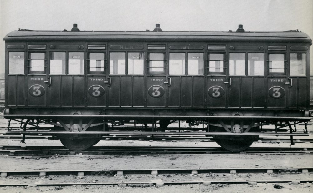 A third class coach built in 1903 at Bow. 2d flat rate return workman's tickets were valid in this. The three little chimneys are for gas lights which were installed throughout these trains. Image courtesy Science Museum Group.