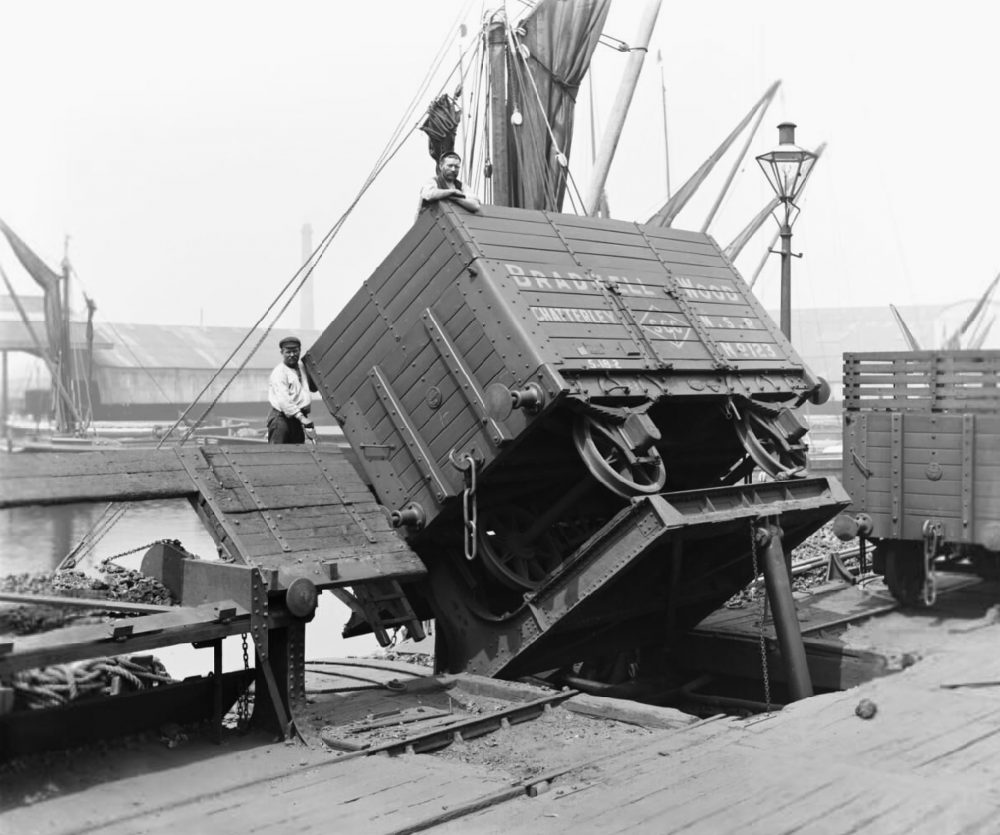 A coke wagon on a hydraulic tip in Poplar Docks, 1898. Image courtesy Science Museum Group.