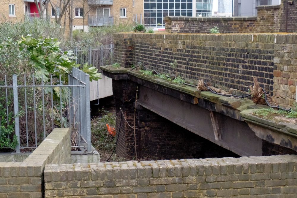 By St Pancras Way, off Tredegar Road. From 1851 - 1944 passenger trains ran underneath here. Freight trains continued until 1984.