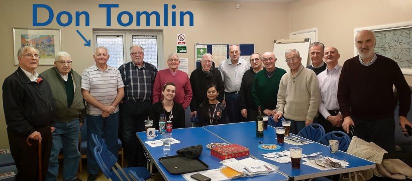 Don in a collective group photograph with two members from Tower Hamlets Health and all The Geezers members at the Tredegar Community Centre