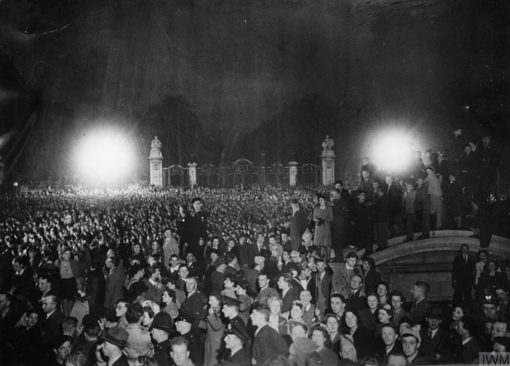 A crowd gathered outside the gates of Buckingham Palace on VE Day.