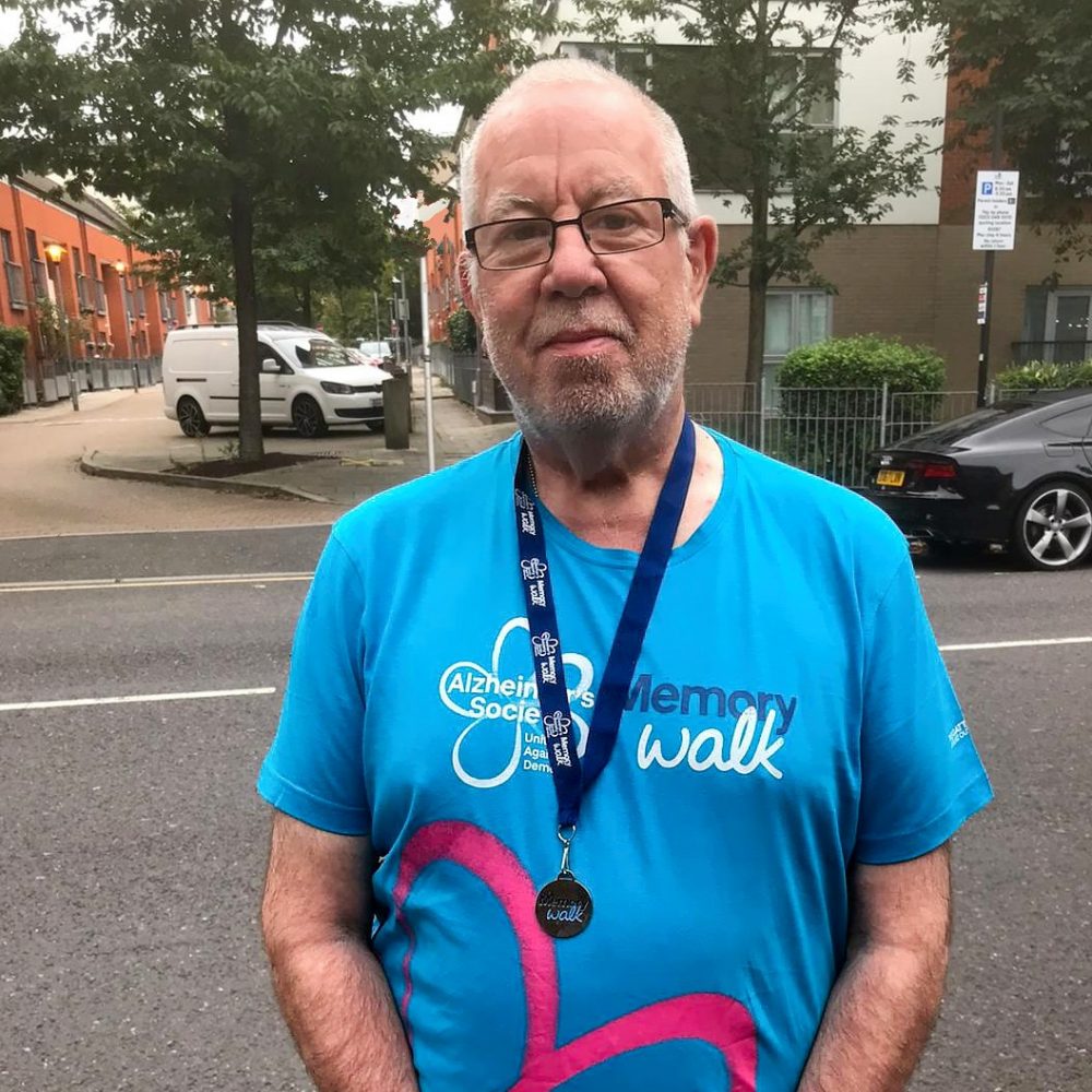 Barrie Stradling with his Alzheimer's Memory walk T-Shirt and medallion