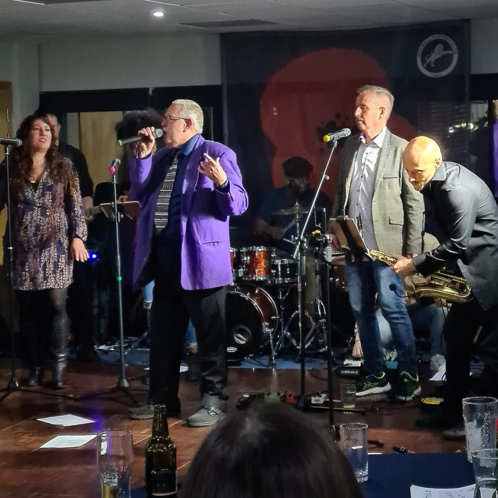 Barrie Stradling and the band on stage at Millwall Football Club