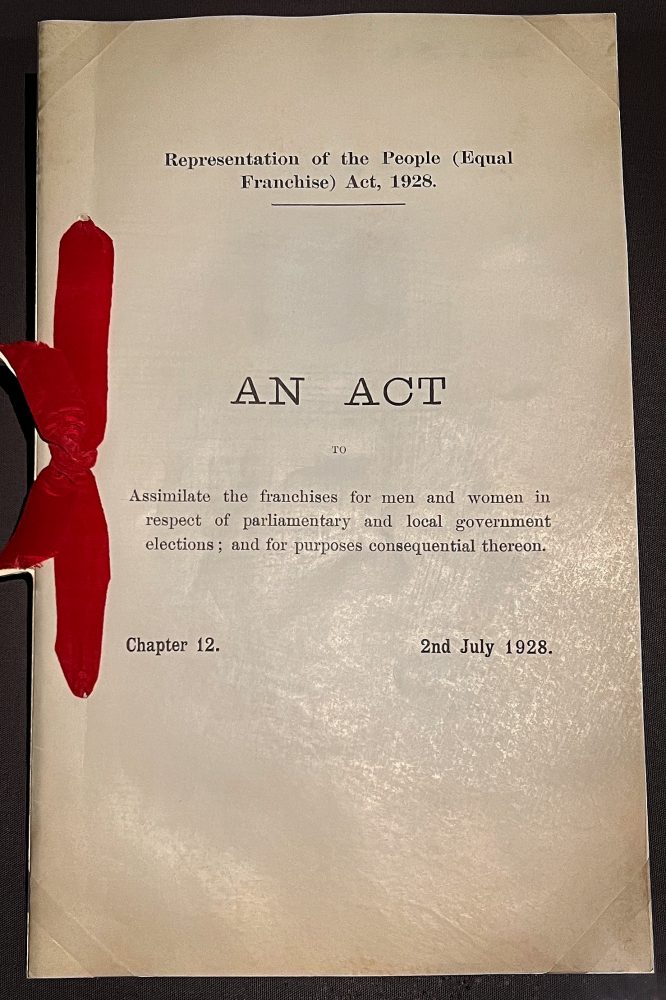 1928 Representation of the People Act photographed in a glass case at the National Archives