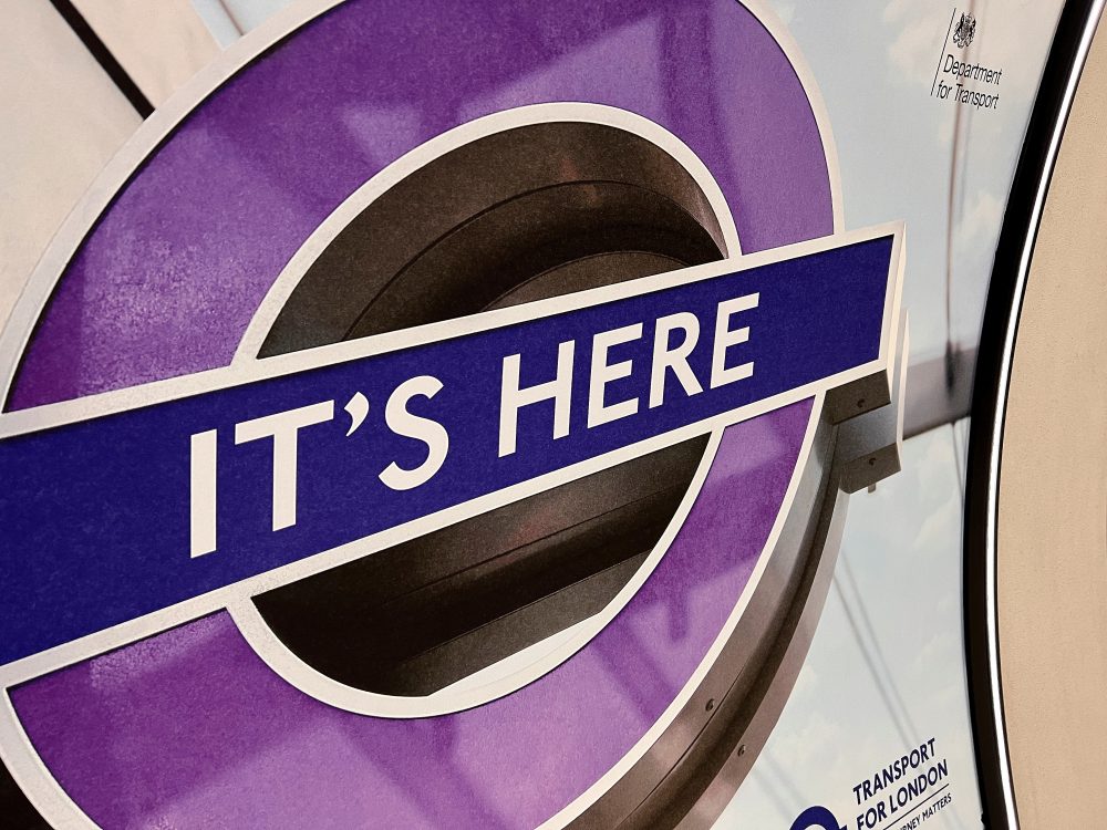 It's Here sign on Elizabeth Line