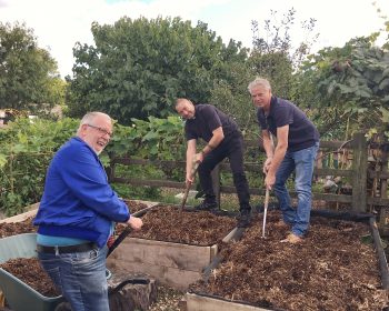 The Geezers at Stepney City Farm. Barrie Starding left, Eddie Snooks right, and Father Brian from St Barnabas Church centre