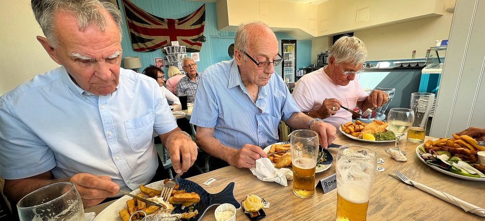 Geezers enjoying cod and chips in The Britannia at Dungeness