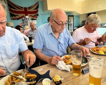 Geezers enjoying cod and chips in The Britannia at Dungeness