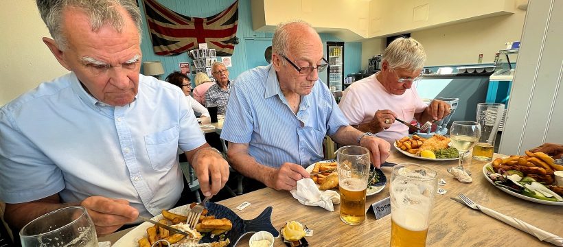 Geezers enjoying cod and chips in The Britannia at Dungeness