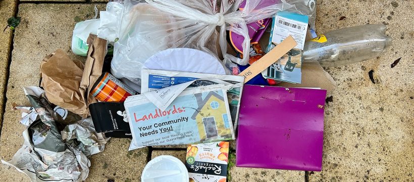 A refuse bag ripped open by a fox