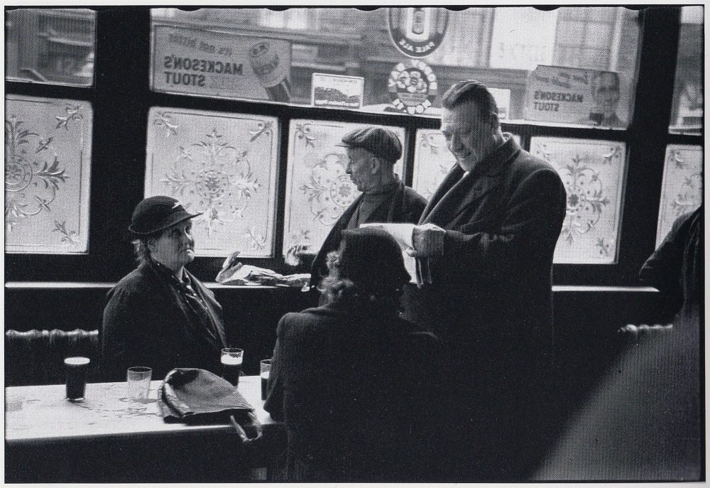 From a 1938 Picture Post article "Lambeth Walk" Their caption says, "The Feathers, one of the few refuges from the very small houses which were often filled with children."