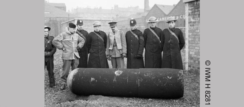 Photo courtesy of the Imperial War Museum (© IWM H 8281). It shows Police and Army bomb disposal officers with a defused German 1000kg 'Luftmine' (parachute mine) in Glasgow, 18 March 1941.