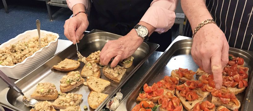 Geezers prepare bruschetta