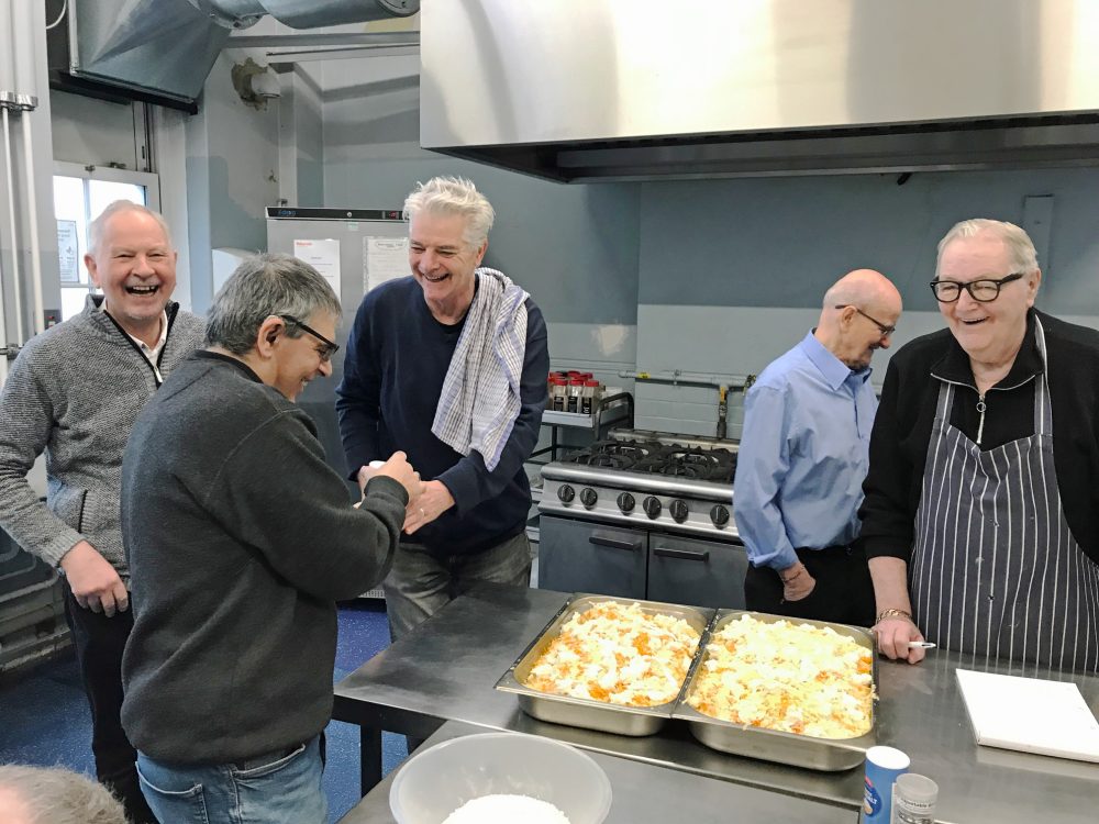 Geezers laughing in the kitchen