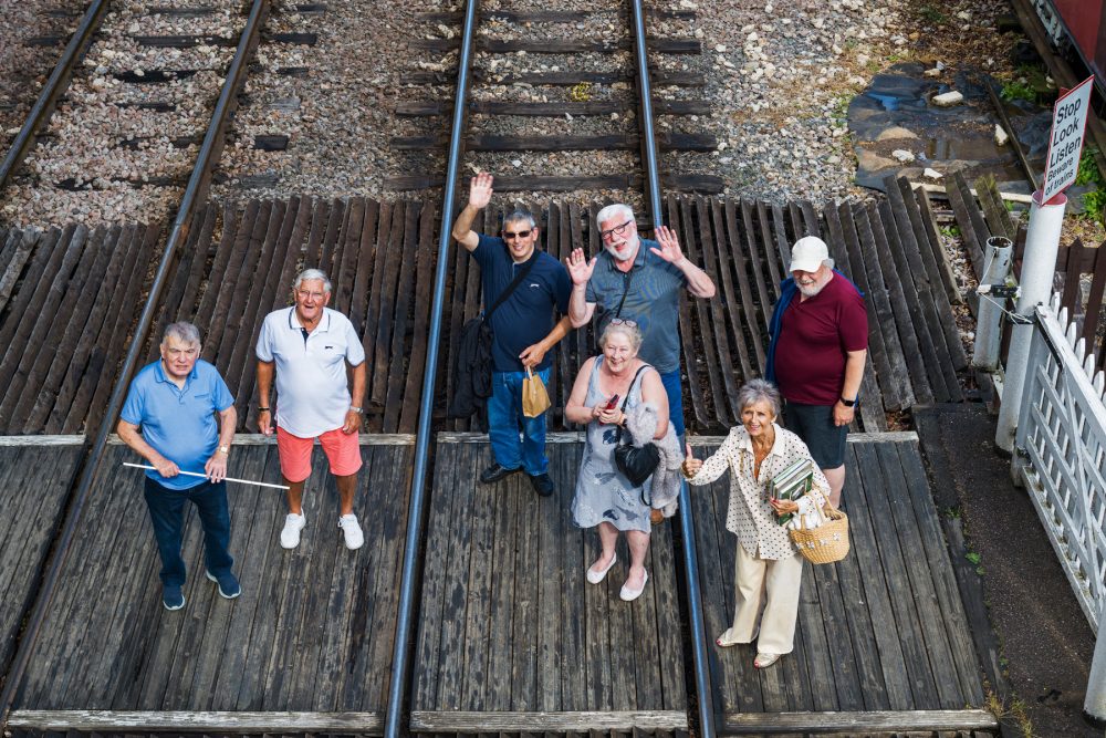 Geezers and their wives on a railway track