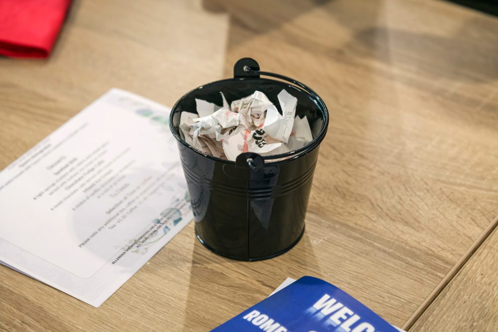 Bucket of used betting slips