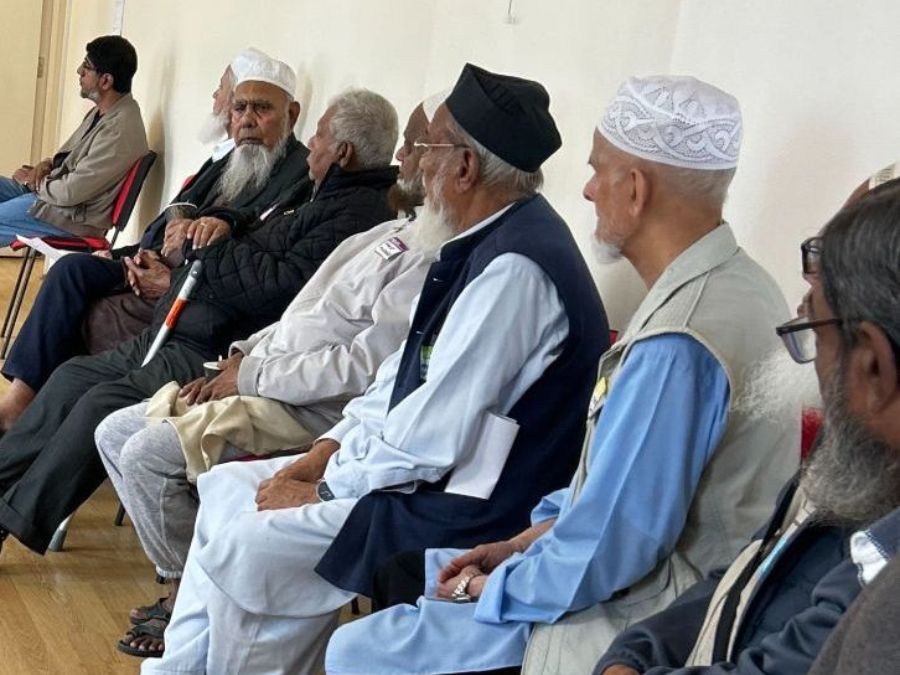 Group of 9 men sitting